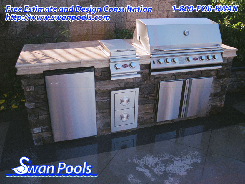 Straight Barbeque with custom tile top and ledger stone sides.