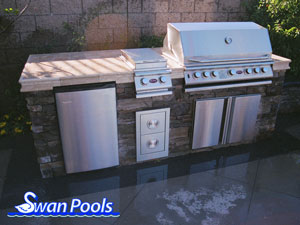 Straight Barbeque with custom tile top and ledger stone sides.  Click on image for a larger picture.