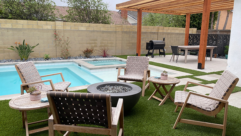 Swan Pools, an award winning swimming pool builder, created a custom sunny oasis in the rolling hills of Northern California.  The classic Californian relaxation swimming pool includes stone coping, stone deck, led lighting, mottled grey plaster, and a freestanding lattice patio cover.  The swimming pool in the surrounding environment invites relaxation on a long, sunny Sunday afternoon.